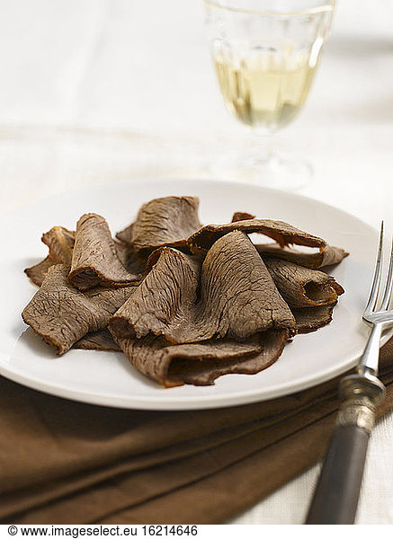 Marinated beef carpaccio with wine,  close-up