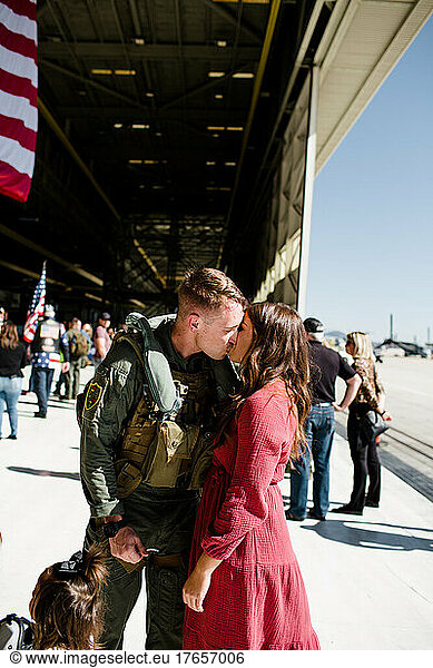 Marine Kissing Wife & Reuniting with Family in San Diego