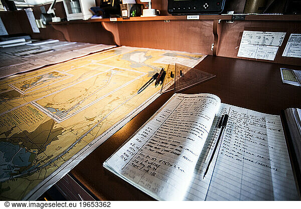Maritime navigation maps on board a container ship passing through the Suez Canal.