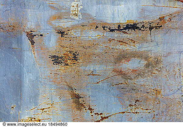 Marks and rust patterns on metal containers  close up.