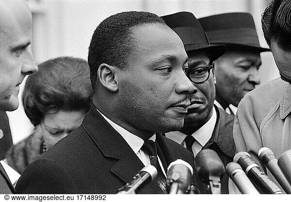 Martin Luther King  Jr.  at Microphones  after meeting with President Lyndon Johnson to discuss Civil Rights  at White House  Washington  D.C. USA  Warren K. Leffler  December 3  1963