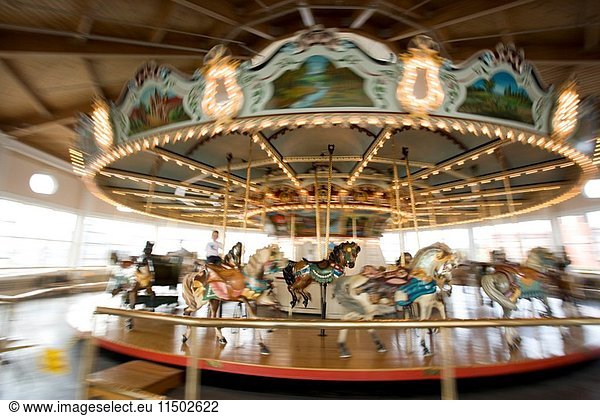 Mary go round. Carousel horses  Fall River  MA   Massachussets   U.S.A.   Motion blur
