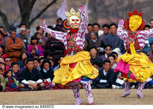 Masked dancers of the Royal Troupe perform Skeleton Dance  Paro  Bhutan