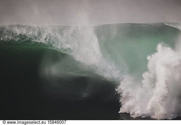 Massive wave spiting a huge barrel under the cliffs of Moher  Ireland
