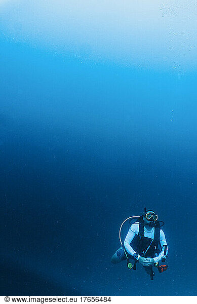 mature adult man exploring the tropical water in the Maldives