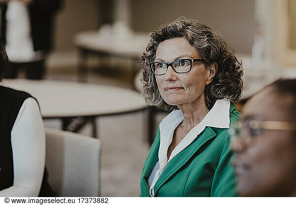 Mature female entrepreneur looking away in office