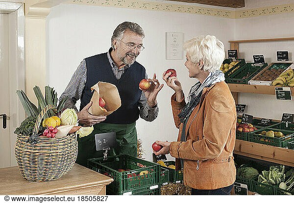 Mature woman buying fruits and vegetables in the store  Bavaria  Germany