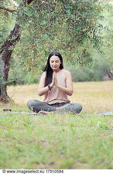 Mature woman during yoga in park