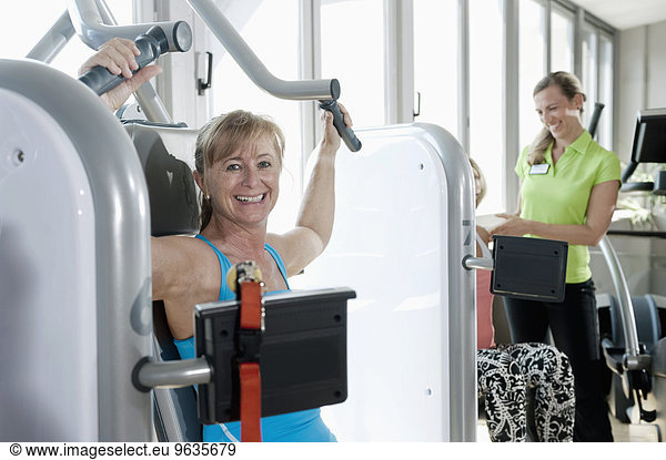 Mature woman fitness trainer studio practicing
