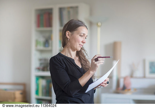 Mature woman reading document