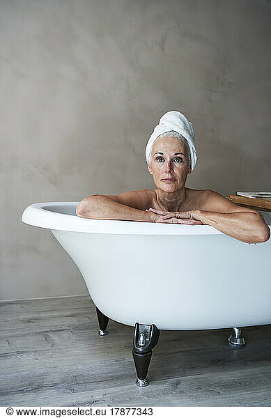 Mature woman relaxing in bathtub