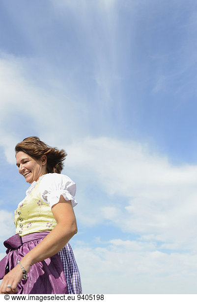 Mature woman running and smiling