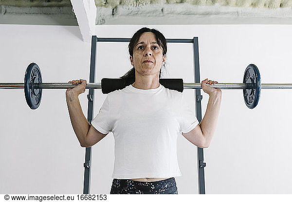 Mature woman training at gym