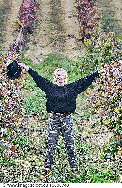 Mature young blondy farmer woman in a farmland with vineyards. Iguzkiza  Navarre  Spain  Europe.