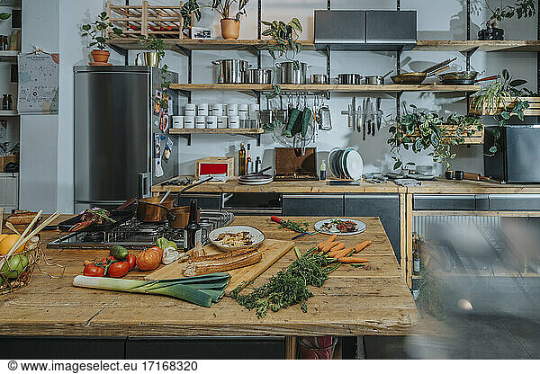 Meat and vegetables on kitchen counter at kitchen