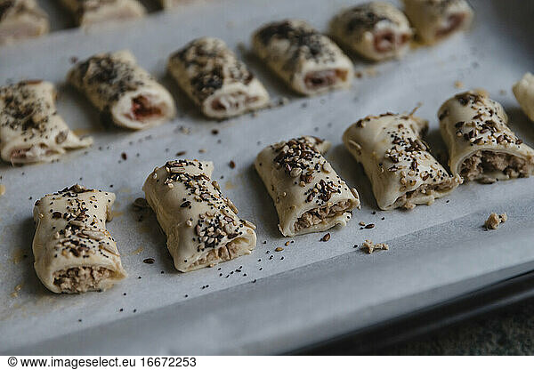 Meat rolls with sesame on tray