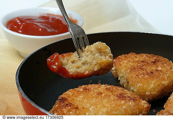 Meat substitute in pan and bowl with ketchup  imitation meat  nugget  Germany  Europe