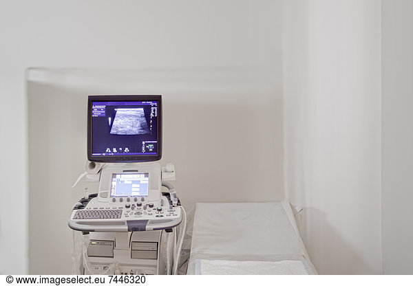 Medical Diagnostics Center  Ultrasound test computer equipment  a computer monitor screen  and a treatment bed