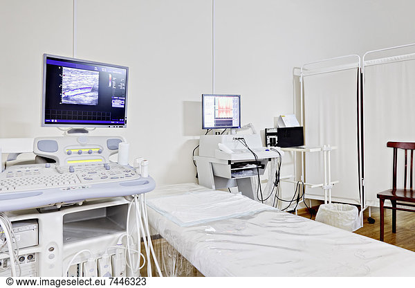Medical Diagnostics Center  Ultrasound test computer equipment  a computer monitor screen  and a treatment bed