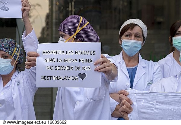 Medical staff from the Hospital Clinic in Barcelona asking citizens to be responsible and observe lockdown during Covid-19 pandemic.