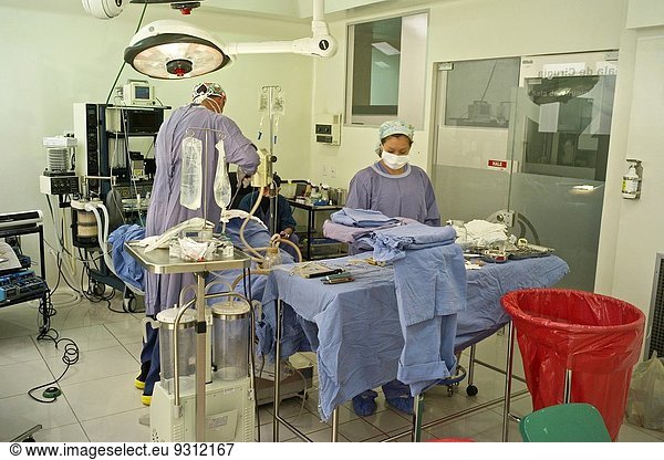 Medical tourism is rapidly-growing practice of traveling across international borders to obtain health care  specially plastic surgery. Colombia is one of the three leading countries worldwide for plastic surgery  along with Brazil and Mexico. Companies such as The Medical Trip  offer packages including flights  hotels and city tours. Pictured: Model released photo of Surgeon Andres Mejia performing a full body liposuction (liposculpture) at Santa Barbara Clinic in Bogota  cast of the television show Extreme Makeover in Colombian Television.