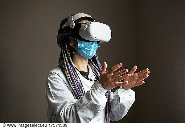 Medical worker is using virtual reality helmet