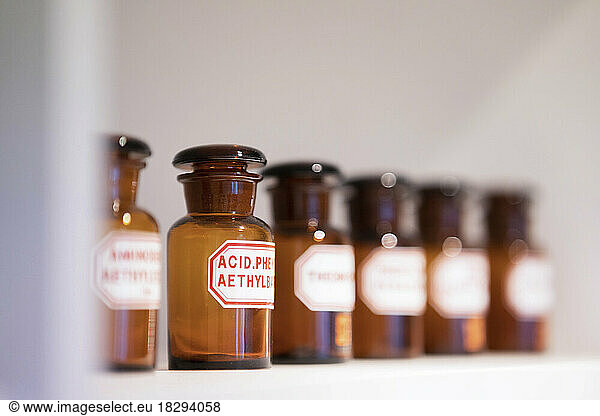Medicine bottles with label on rack