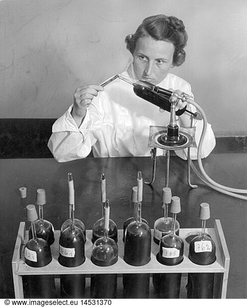 medicine  laboratory  laboratory assistent closing ampoules for blood transfusions  1940