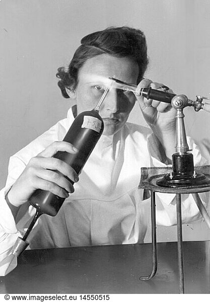 medicine  laboratory  laboratory assistent closing ampoules for blood transfusions  1940