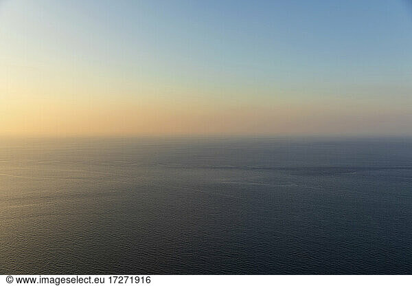 Mediterranean Sea at dusk with clear line of horizon in background