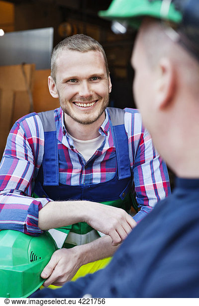 Men smiling at work