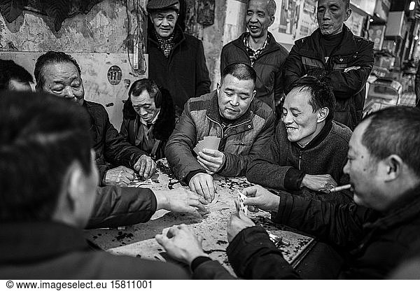Merchants playing cards in the harbour area of Chongqing  China  Asia