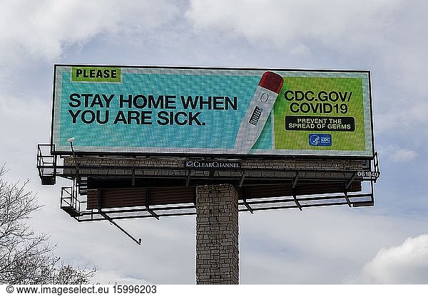 Message on a billboard relating to the coronavirus to stay home if you are sick  Mounds View  Minnesota.