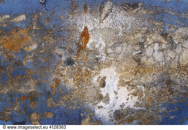 Metallic blue surface damaged by heat exposure