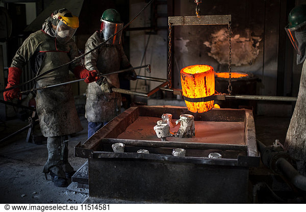 Metalworkers working in foundry