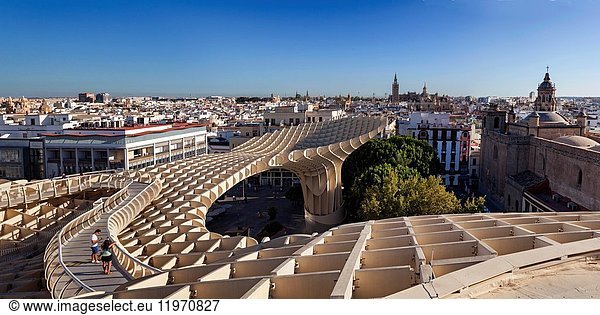 Metropol Parasol  Mushrooms of the Incarnation is a wooden structure with 2 columns of concrete that house elevators to the lookout and is located in the central Plaza de la Encarnacion in Seville  Andalucia  Spain.