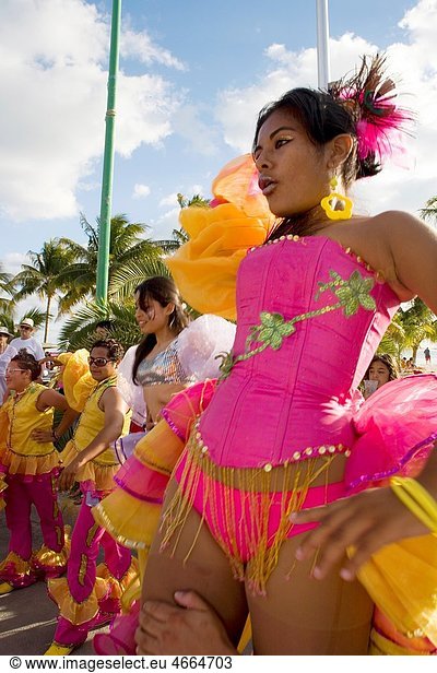 MEXICAN GIRLS WEARING CARNIVAL CLOTHES DANCING AND PARTICIPATING AT ISLA MUJERES MEXICAN LOCAL CARNIVAL  ISLA MUJERES  MEXICO  CENTRAL AMERICA