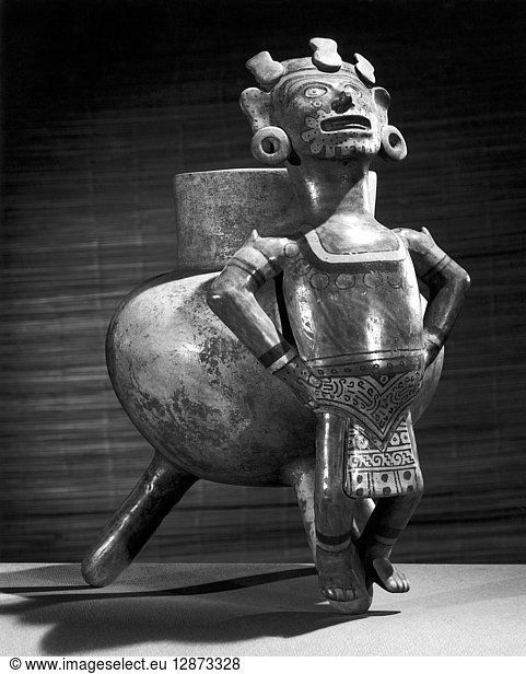 MEXICO: MIXTEC VASE. Mixtec polychrome vase with a figure of Maquilzochitl the god of song and dance. From Miahuatlan Oaxaca Mexico 8th-15th century. Height: 12.25 inches.