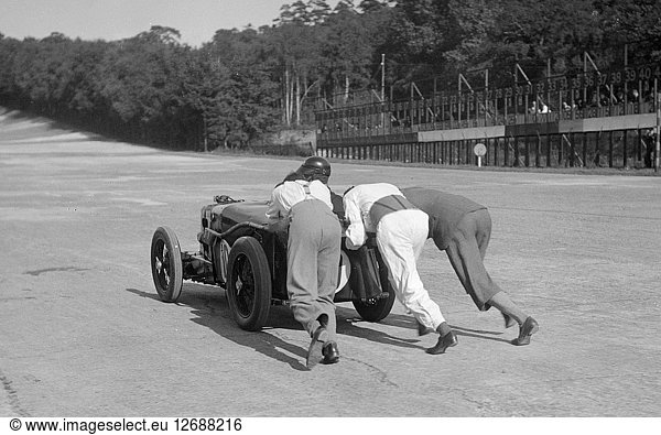 MG C type receiving a push at Brooklands  1931 Artist: Bill Brunell.