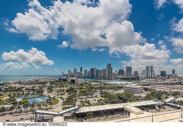 Miami  FL  United States - April 27  2019: Downtown of Miami Skyline viewed from Dodge Island with Cruise terminal at Biscayne Bay in Miami  Florida  USA. Wide angle view.