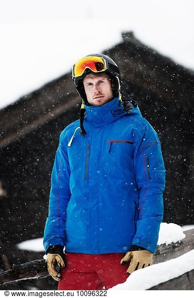 Mid adult man wearing ski jacket and helmet  portrait