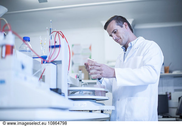 Mid adult man working in laboratory