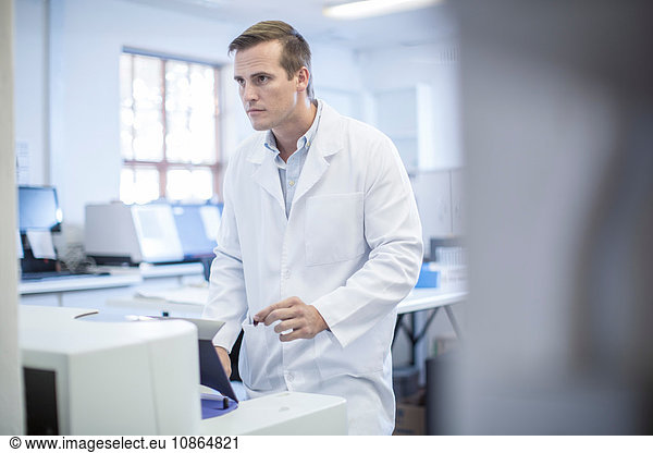 Mid adult man working in laboratory
