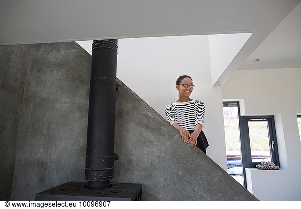Mid adult woman in modern home interior