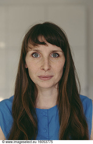 Mid adult woman with gray eyes and bangs