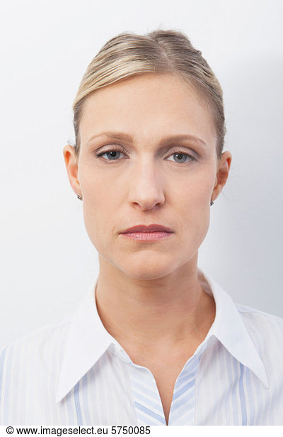 Mid adult woman with serious expression  portrait
