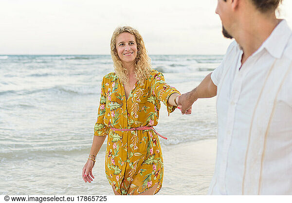 mid aged caucasian woman looking at her husband and smiling