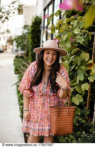 Mid 30's Hispanic Woman Modeling Clothing & Laughing in San Diego
