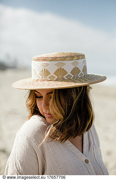 Mid Thirties Mixed Race Woman Modeling Hat & Clothing in San Diego