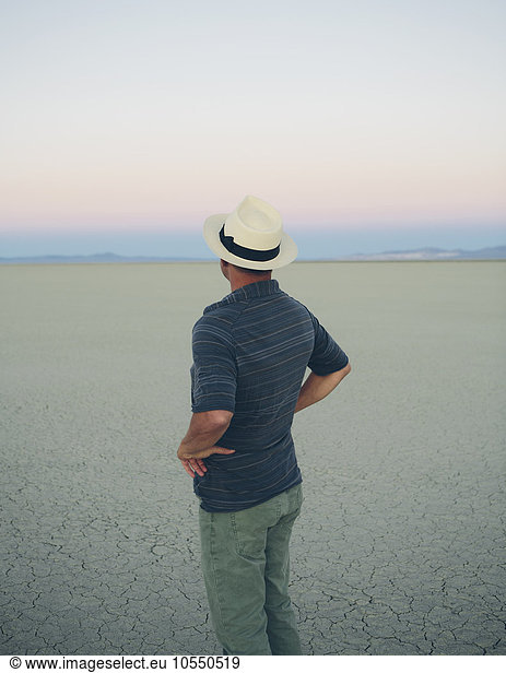 Middle aged man at dawn in the Black Rock Desert  Nevada